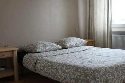 Un ou plusieurs lits dans un hébergement de l'établissement Cosy F2 Basel Saint-Louis