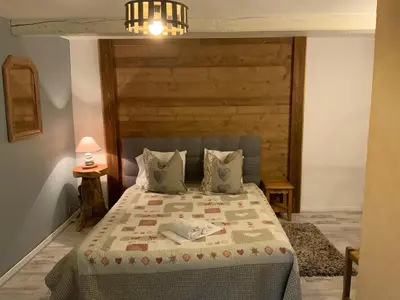 Un ou plusieurs lits dans un hébergement de l'établissement Auberge De La Grange spa & sauna