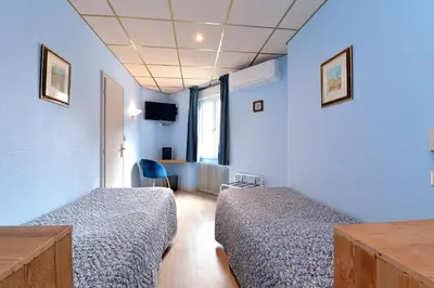 Un ou plusieurs lits dans un hébergement de l'établissement Hotel Restaurant Dontenville