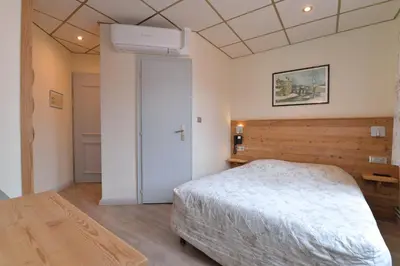 Un ou plusieurs lits dans un hébergement de l'établissement Hotel Restaurant Dontenville
