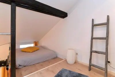 Un ou plusieurs lits dans un hébergement de l'établissement Appartement La Terrasse sur cour