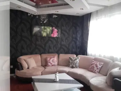 Coin salon dans l'établissement Appartement La Bagatelle