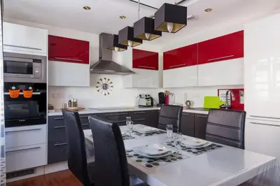 Cuisine ou kitchenette dans l'établissement Appartement La Bagatelle
