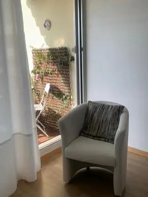 Coin salon dans l'établissement Bel Appartement near Bâle Mulhouse Airport