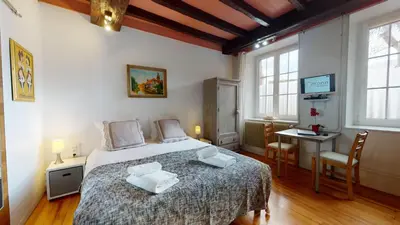 Un ou plusieurs lits dans un hébergement de l'établissement Le Clos bartholdi