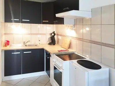 Cuisine ou kitchenette dans l'établissement Le Cocon appart avec parking privé & terrasse
