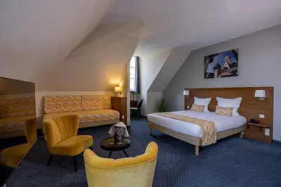 Un ou plusieurs lits dans un hébergement de l'établissement Hôtel Val-Vignes Colmar Haut-Koenigsbourg, The Originals Relais