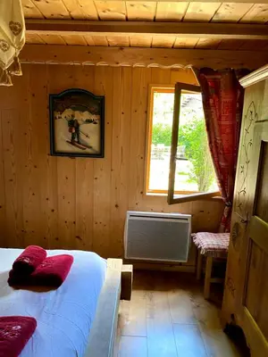 Un ou plusieurs lits dans un hébergement de l'établissement Chalet d' Annelise