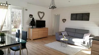 Coin salon dans l'établissement Au Petit Bonheur Charmant Gite Colmar