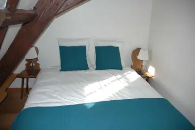Un ou plusieurs lits dans un hébergement de l'établissement appartement à Colmar