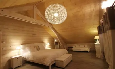 Un ou plusieurs lits dans un hébergement de l'établissement Chambres d'hôtes Couleurs Bois & Spa
