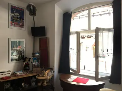 Télévision ou salle de divertissement dans l'établissement Le Bratzala