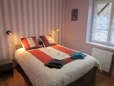 Un ou plusieurs lits dans un hébergement de l'établissement Gîte Faubourg des Pierres