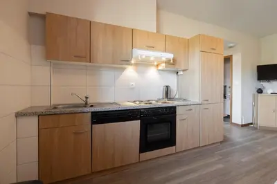 Cuisine ou kitchenette dans l'établissement SARL HARTWEG Les Amandiers