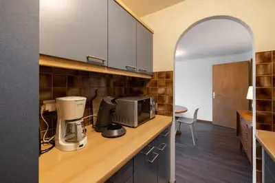 Cuisine ou kitchenette dans l'établissement SARL HARTWEG Les Amandiers