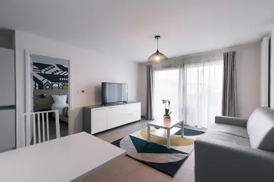 Télévision ou salle de divertissement dans l'établissement Aparthotel Adagio Bâle Mulhouse Aeroport