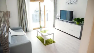 Télévision ou salle de divertissement dans l'établissement Aparthotel Adagio Bâle Mulhouse Aeroport