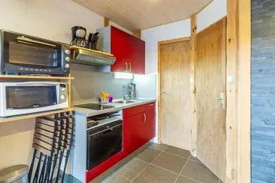Cuisine ou kitchenette dans l'établissement Esprit Myrtille Terrasse Vue Lac