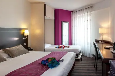 Un ou plusieurs lits dans un hébergement de l'établissement Brit Hotel Belfort Centre-Le Boreal