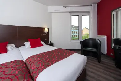 Un ou plusieurs lits dans un hébergement de l'établissement Brit Hotel Belfort Centre-Le Boreal