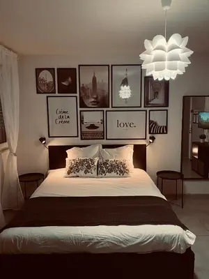 Un ou plusieurs lits dans un hébergement de l'établissement Travel Homes - Le Bright'N Cosy en pleine ville