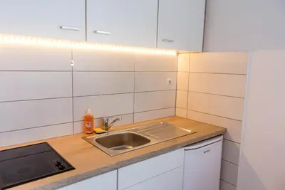 Cuisine ou kitchenette dans l'établissement Travel Homes - Le Bright'N Cosy en pleine ville