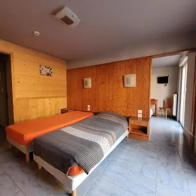 Un ou plusieurs lits dans un hébergement de l'établissement Hotel du lac des Corbeaux