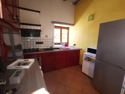 Cuisine ou kitchenette dans l'établissement Le gite de Coco