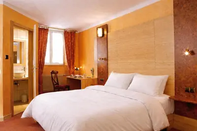 Un ou plusieurs lits dans un hébergement de l'établissement Hôtel A la Vignette - COLMAR-NORD