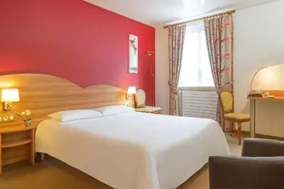 Un ou plusieurs lits dans un hébergement de l'établissement Hôtel A la Vignette - COLMAR-NORD