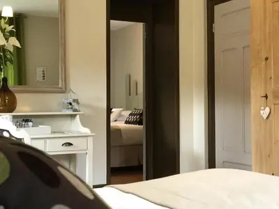 Un ou plusieurs lits dans un hébergement de l'établissement LES ÉCRINS - B&B with jacuzzi