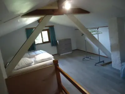 Un ou plusieurs lits dans un hébergement de l'établissement cottage pleine nature