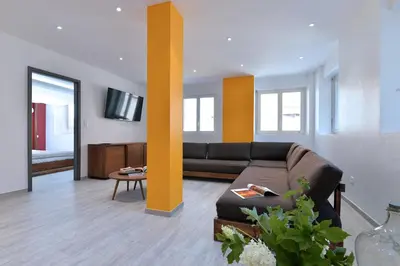 Coin salon dans l'établissement Les Suites Du Cygne