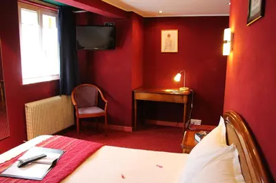 Un ou plusieurs lits dans un hébergement de l'établissement Hôtel Restaurant La Cigogne
