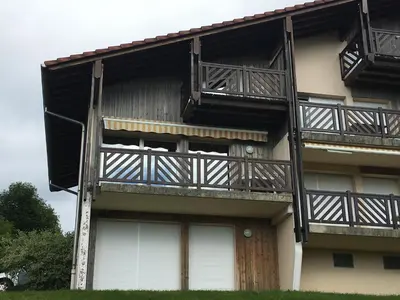 Balcon ou terrasse dans l'établissement Les Loges du Lac - Appartement avec Terrasse