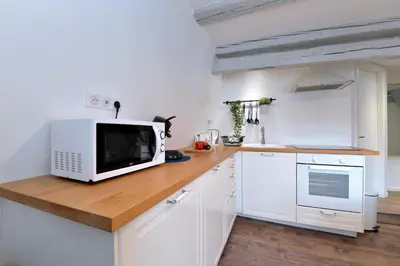 Cuisine ou kitchenette dans l'établissement Appartement L'Authentique de la Petite Venise