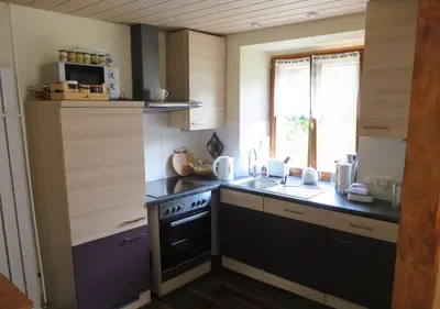 Cuisine ou kitchenette dans l'établissement Petit Papillon