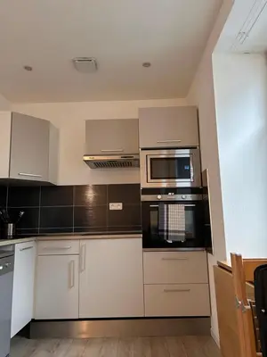 Cuisine ou kitchenette dans l'établissement Le 1 - Très beau T3 Neuf rez-de-chaussée centre ville - stationnement gratuit