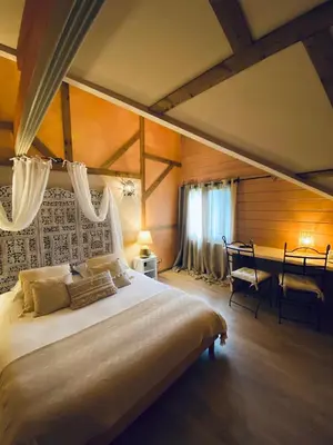 Un ou plusieurs lits dans un hébergement de l'établissement Le Chalet d'Etienne
