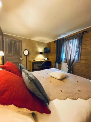 Un ou plusieurs lits dans un hébergement de l'établissement Le Chalet d'Etienne