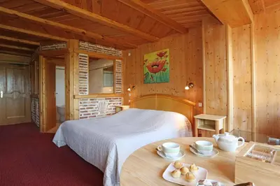 Un ou plusieurs lits dans un hébergement de l'établissement Auberge La Meuniere