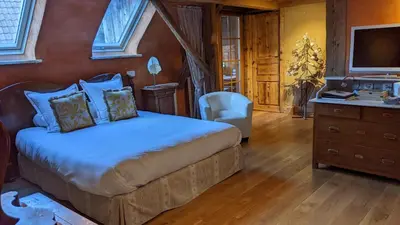 Un ou plusieurs lits dans un hébergement de l'établissement La Maison d'Artgile