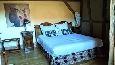Un ou plusieurs lits dans un hébergement de l'établissement La Maison d'Artgile