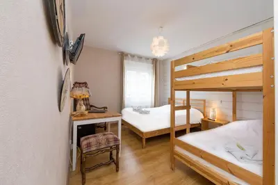 Un ou plusieurs lits dans un hébergement de l'établissement Hôtel Restaurant l'Aubergade