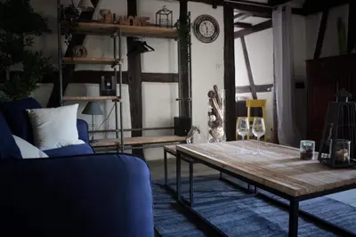 Coin salon dans l'établissement Sous les toits du Zinc - Climatisé