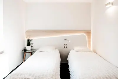 Un ou plusieurs lits dans un hébergement de l'établissement Logis Hôtel Restaurant Au Lion Rouge