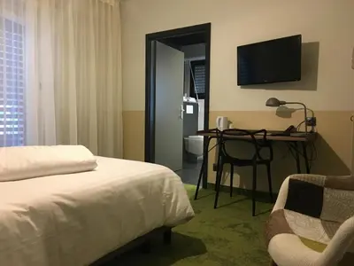 Un ou plusieurs lits dans un hébergement de l'établissement Hotel Restaurant au Floridor
