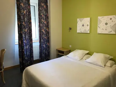 Un ou plusieurs lits dans un hébergement de l'établissement Hôtel du Rangen