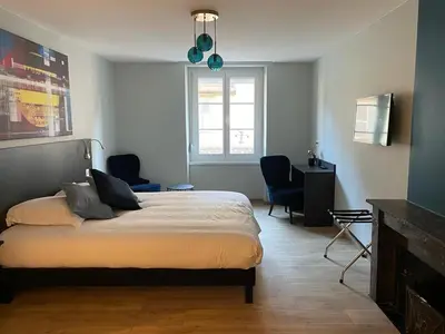 Un ou plusieurs lits dans un hébergement de l'établissement Hotel-Restaurant St-Christophe