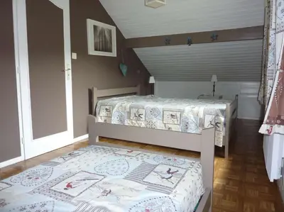 Un ou plusieurs lits dans un hébergement de l'établissement chalet trois étoiles